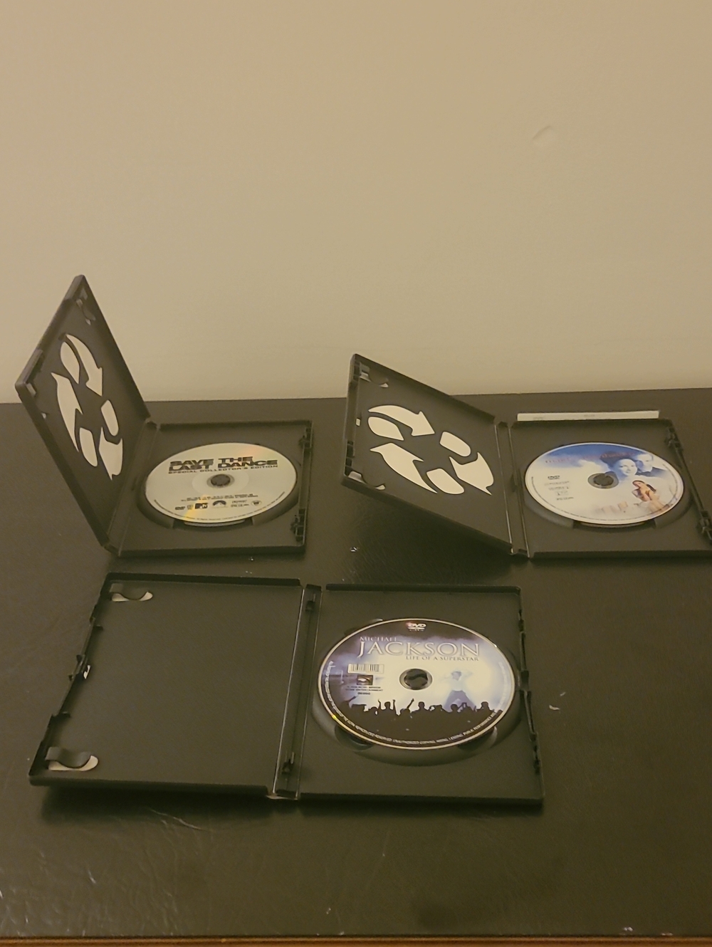 Assorted Black DVD Cases with Music/Media Discs